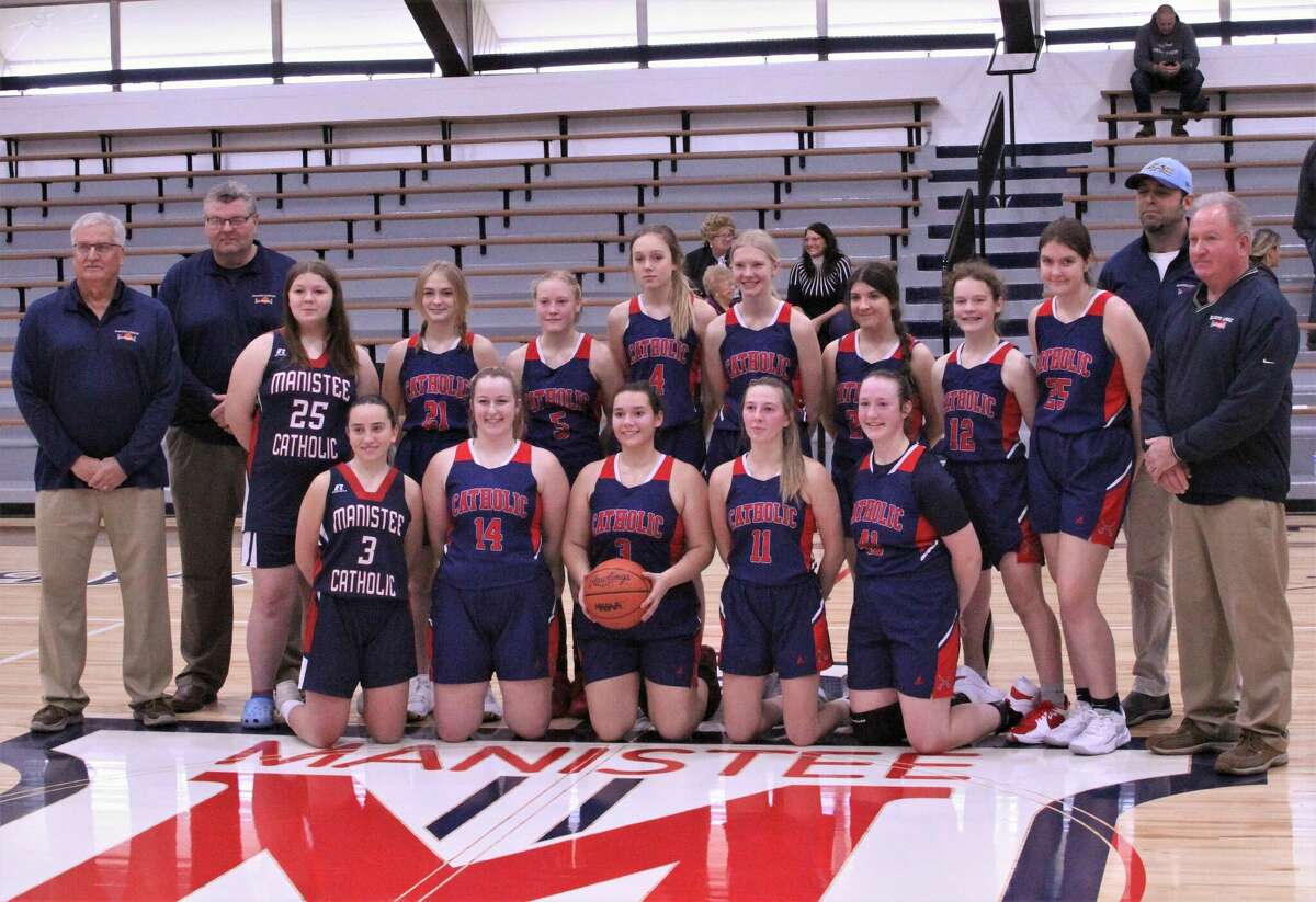 Manistee Catholic Central's girls basketball team poses for a photo after a 44-34 win against Kalamazoo Hackett on Dec. 3, 2022 at Manistee Catholic Central High School. 