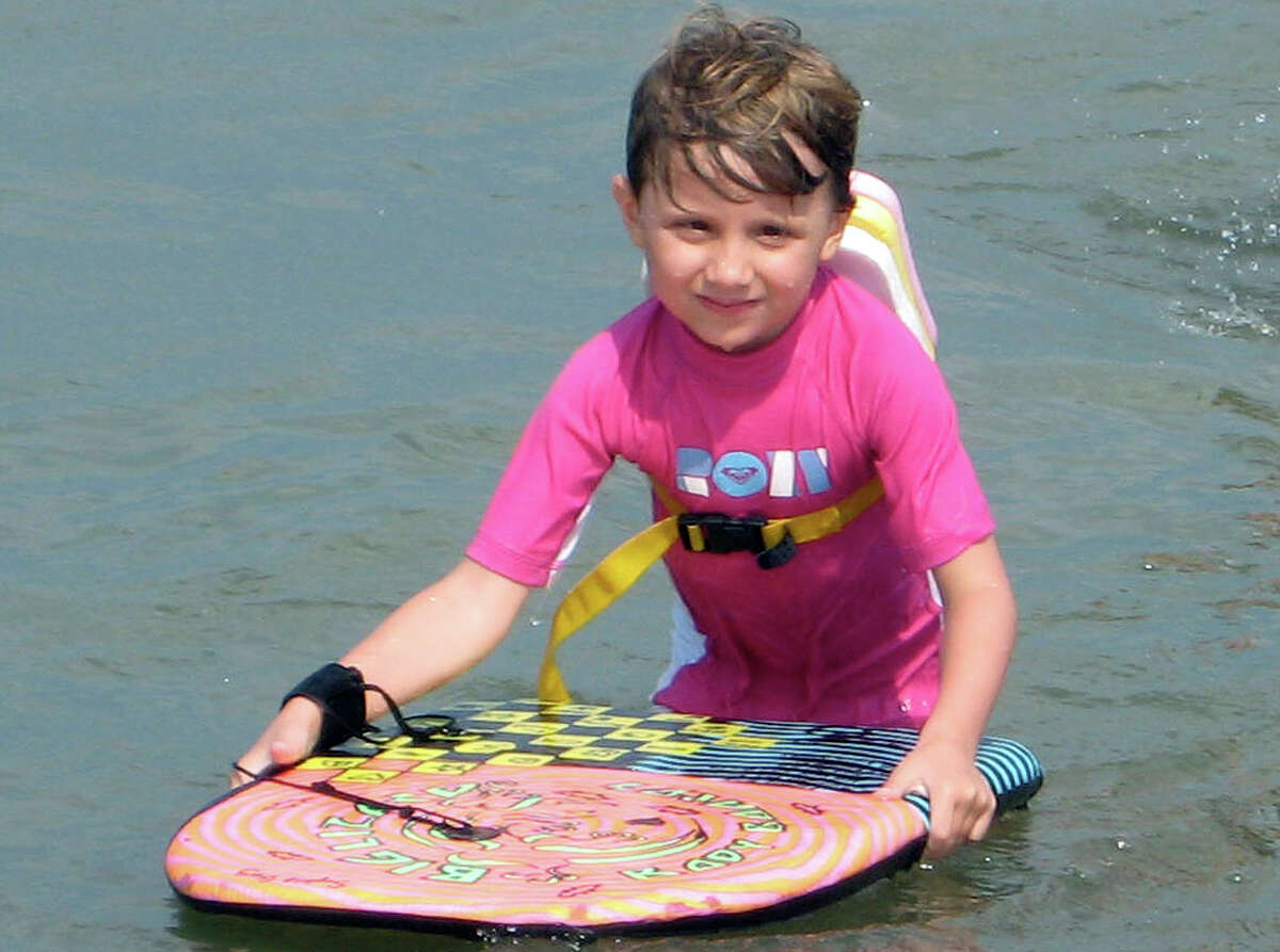 This 2011 photo provided by the Gay family shows Josephine Gay in Bethany Beach, Del., killed Dec. 14, 2012, when a gunman opened fire at Sandy Hook Elementary school in Newtown, Conn. Her parents, Michele and Bob Gay, have set up "Joey's Fund" in her memory through the Doug Flutie Jr. Foundation for Autism to help other families raising children with autism.