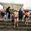 Swimmers get ready to swim in Aquatic Park during a rally to save the Municipal Pier at Aquatic Park in San Francisco on Saturday, Dec. 3, 2022. Built in 1933, the historic landmark was permanently closed by the National Park Service due to safety concerns following an earthquake on Oct. 25.