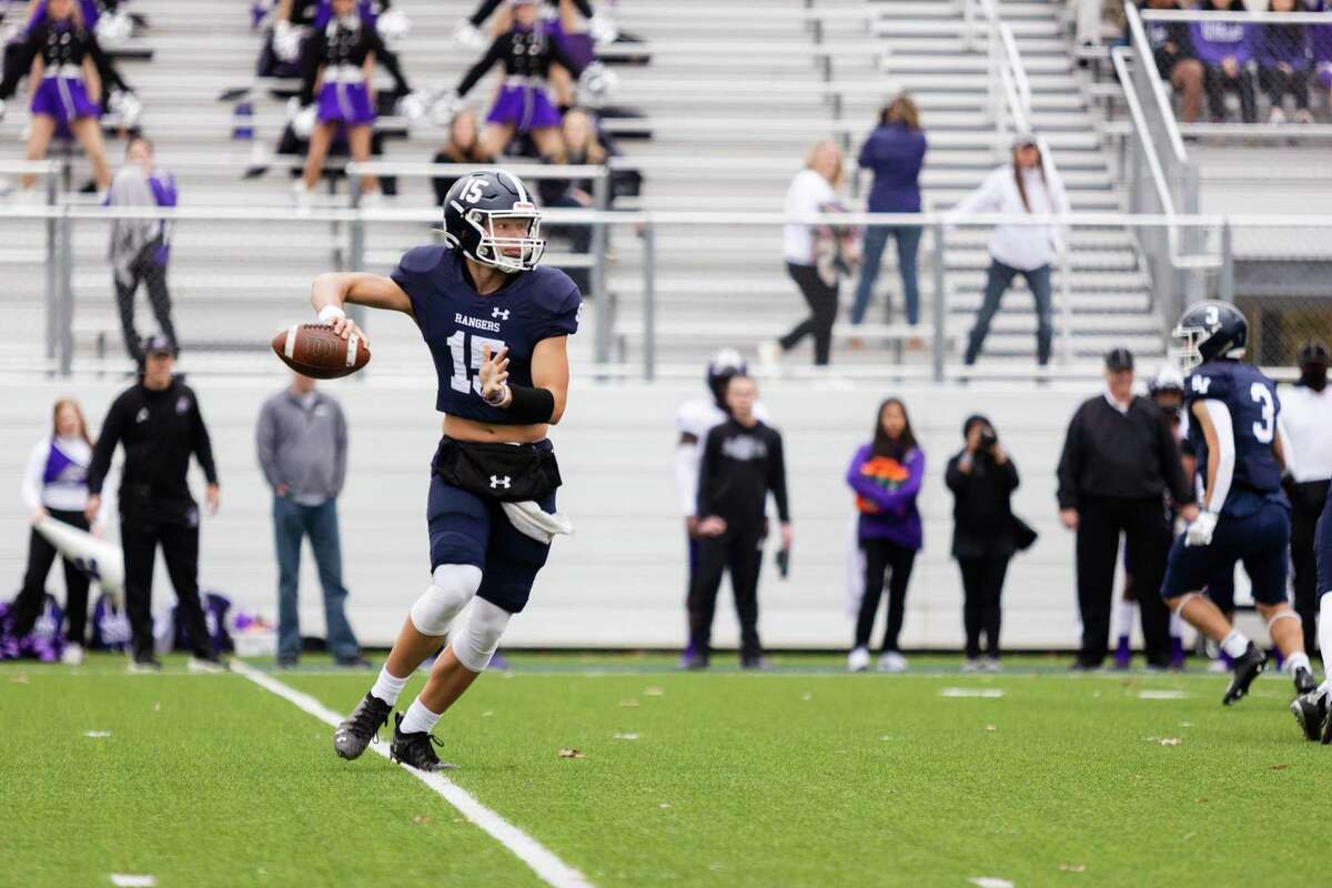 Smithson Valley Rangers' quarterback Ryland Walker throws a pass during a game against the College Station Cougars at the Pfield stadium in Pflugerville on Dec. 3, 2022.