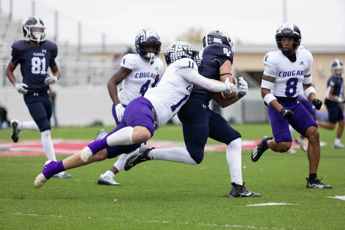 College Station Cougars Trey Minor tackles Mason Birch of the Smithson Valley Rangers during a play at the Pfield stadium in Pflugerville on Dec. 3, 2022.