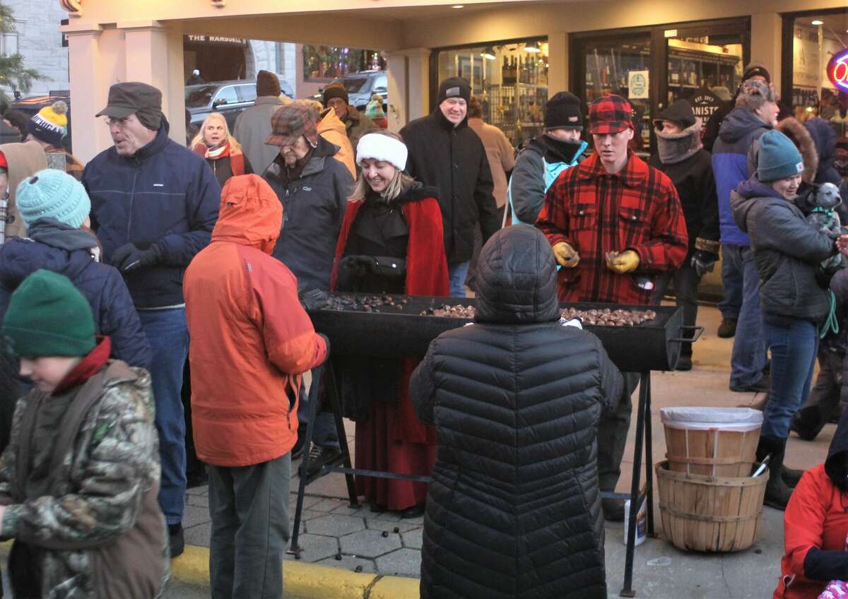 Kendra Thompson Architects had four chestnut grills going on River Street in Manistee Saturday for the Sleighbell Parade.