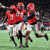 Georgia defensive back Malaki Starks (24) reacts as Georgia defensive back Christopher Smith (29) returns a blocked LSU field goal attempt for a touchdown in the first half of the Southeastern Conference Championship football game Saturday, Dec. 3, 2022 in Atlanta.