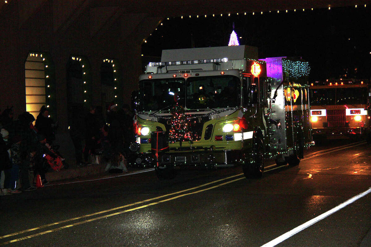 The lead parade vehicle crossed the covered bridge playing Eartha Kitt's version of the song, "Santa Baby" Saturday during the village's first Lighted Christmas Parade.