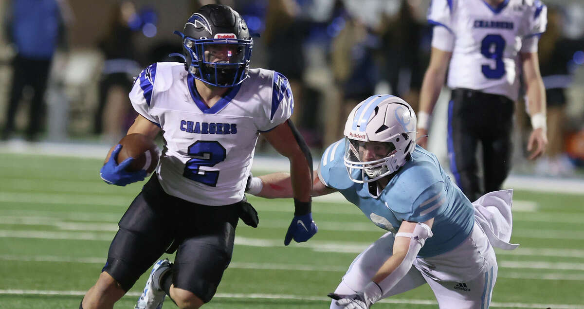 Dallas Christian running back Zachariah Hernandez (2) runs past Cypress Christian Jeffrey Potts (2) in the second half of the TAPPS Division III state football championship, Sat. Dec. 3, 2022, in Waco, Texas.