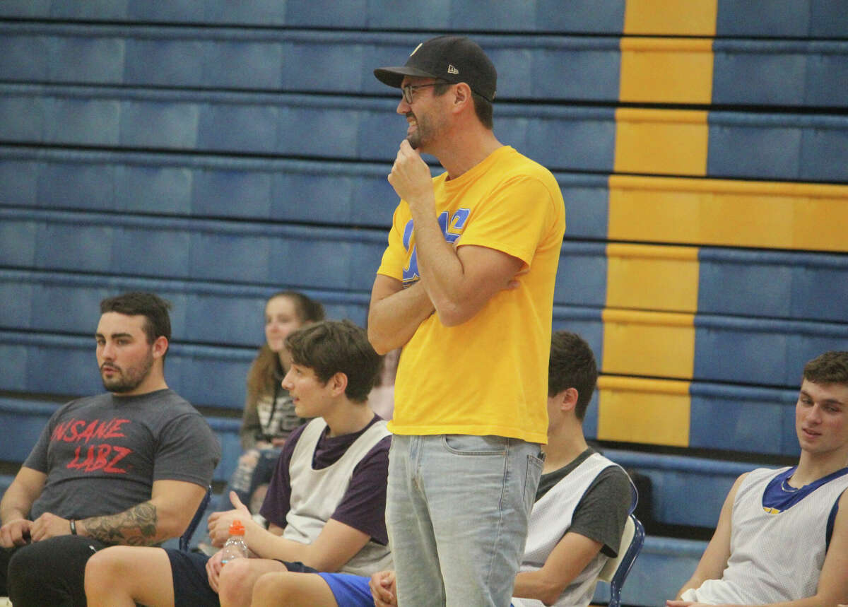 Evart coach Kris Morgan watches his team during a summer camp session.
