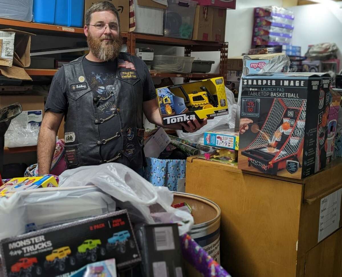 Sanford American Legion Riders Director Shane Talbot with the Toys for Kidz collection Friday at the Sanford American Legion Hall. Hall said the collection more than doubled from 2021.