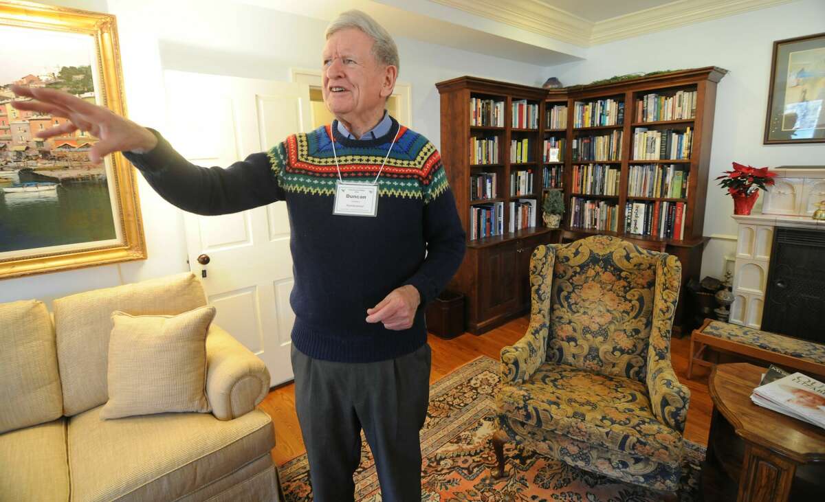 Duncan Charters shows off the living room of his home in Elsah during Saturday's Home for the Holidays House Tour.