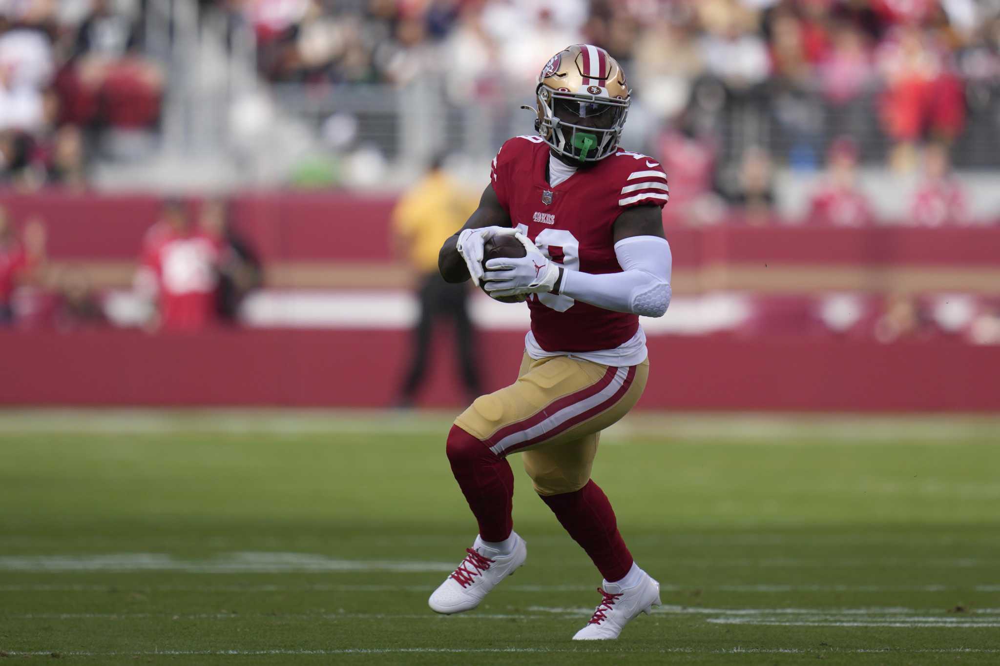 49ers' Deebo Samuel will play with quad injury; Dolphins shorthanded up  front