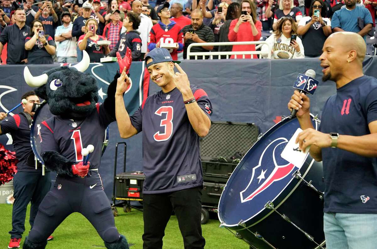 Houston Astros shortstop Jeremy Peña plays a drum with Blue Steel before the start of the first quarter of an NFL football game at NRG Stadium on Sunday, Dec. 4, 2022 inHouston .