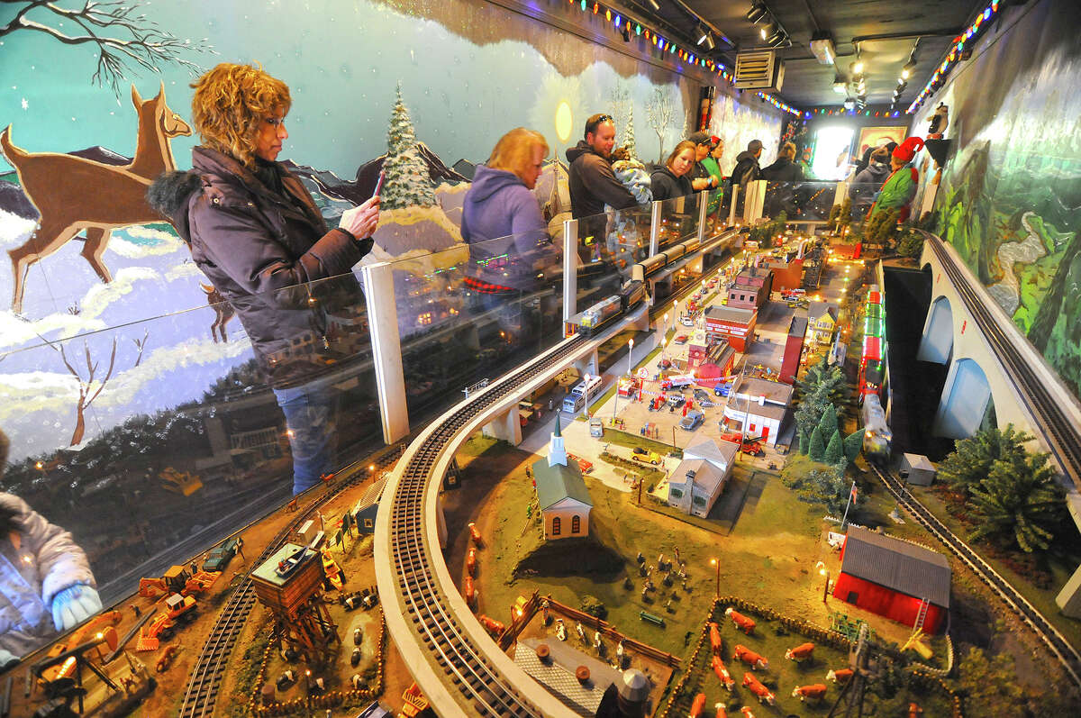 People stroll by the displays inside the KCS Holiday Express when it made a stop in Godfrey in 2018.