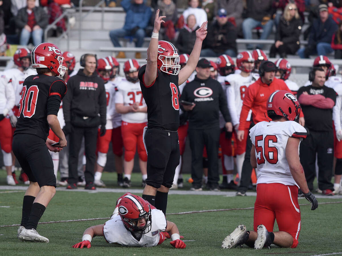New Canaan's Ty Groff (8) celebrates after kicking his third field goal of the game against Cheshire during the CIAC Class L football semifinals at Dunning Field on Sunday, Dec. 4, 2022.