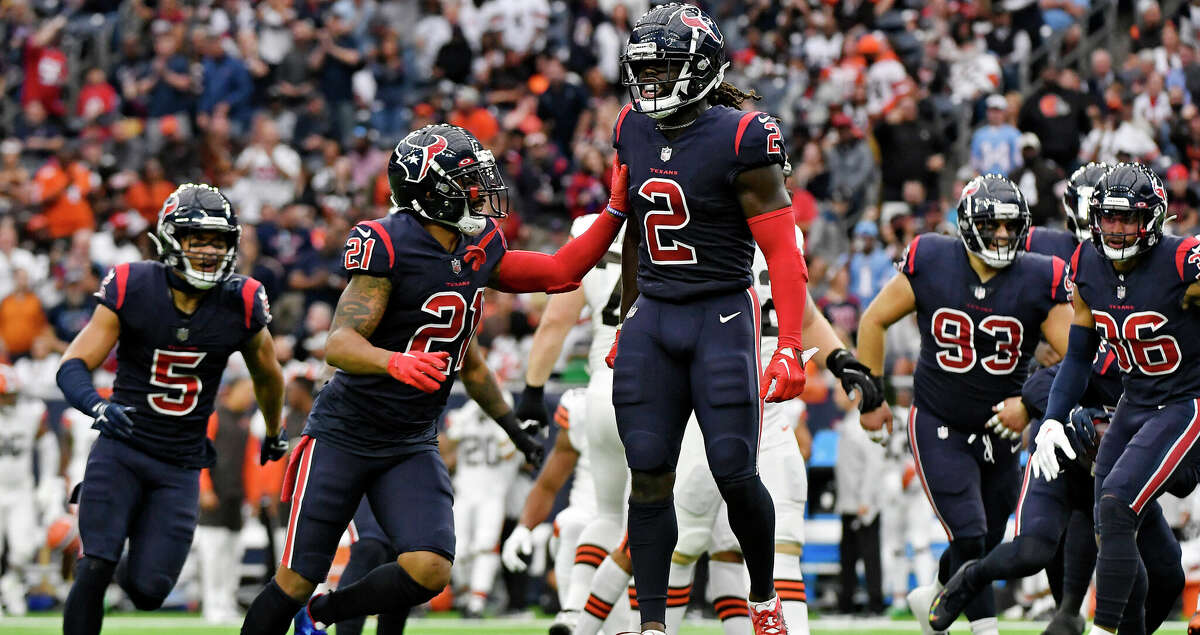 Steven Nelson #21 of the Houston Texans and Tavierre Thomas #2 of the Houston Texans celebrate after a fumble recovery during the first quarter against the Cleveland Browns at NRG Stadium on December 04, 2022 in Houston, Texas. (Photo by Logan Riely/Getty Images)