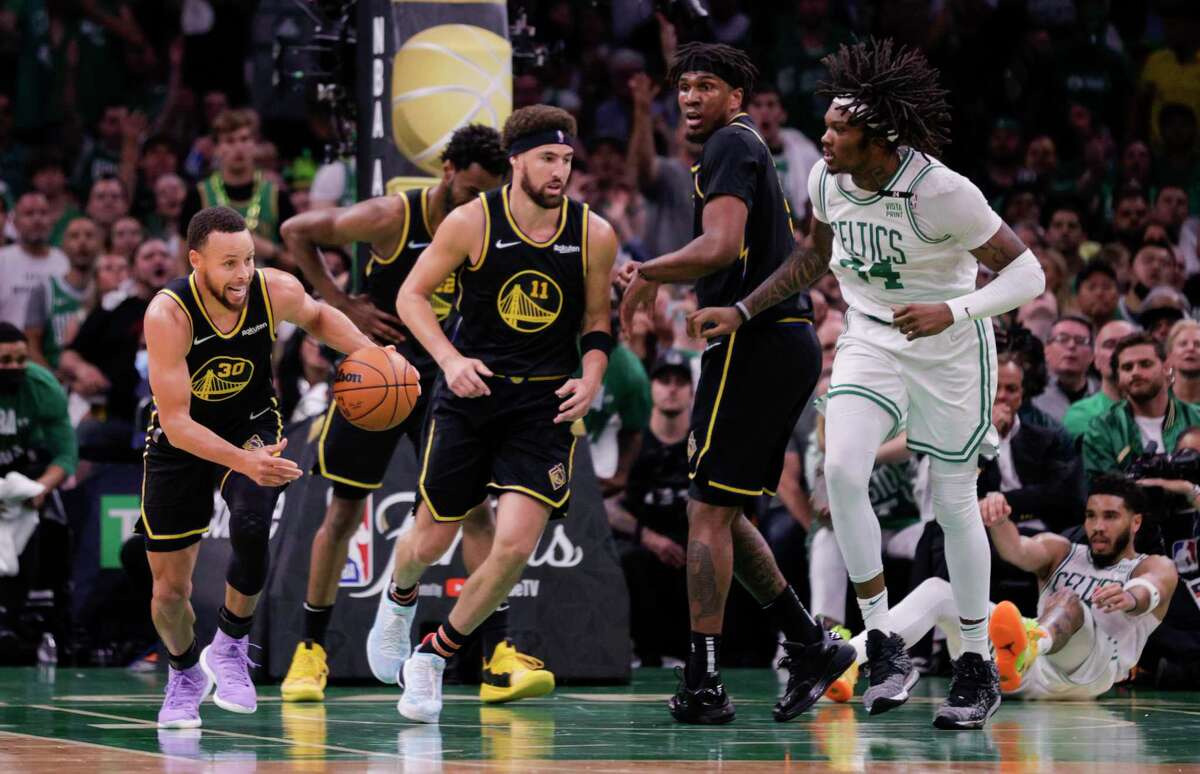 Warriors guard Stephen Curry heads upcourt after grabbing a defensive rebound in Game 4 of the NBA Finals against the Boston Celtics on June 10, 2022. Curry is on pace to set a career high in rebounding, at 6.7 per game.