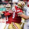 San Francisco 49ers quarterback Brock Purdy (13) looks to make a throw during the second half of a NFL football game against Miami Dolphins in Santa Clara, Calif., Sunday, Dec. 4, 2022. The 49ers defeated the Dolphins 33-17.