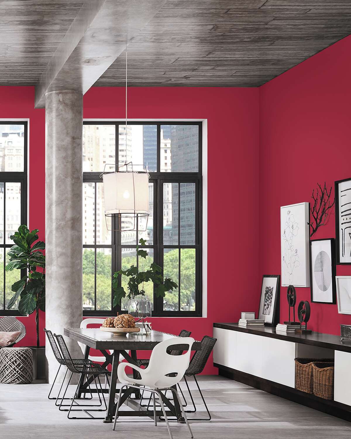 Sherwin-Williams offers up its "Radish" red paint as an option for those who love Pantone's "Viva Magenta" Color of the Year 2023 pick. This dining room is shown painted "Radish" and decorated in gray, black and white.