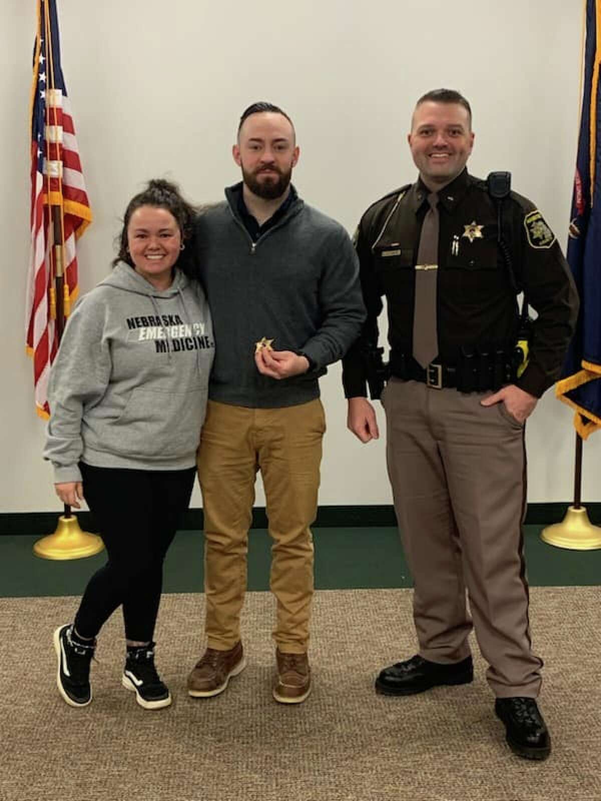 (From left) Katie Fallowfield, Ian Fallowfield and Sheriff Brian Gutowski are shown after a swearing-in ceremony on Friday at the Manistee County Sheriff's Office.