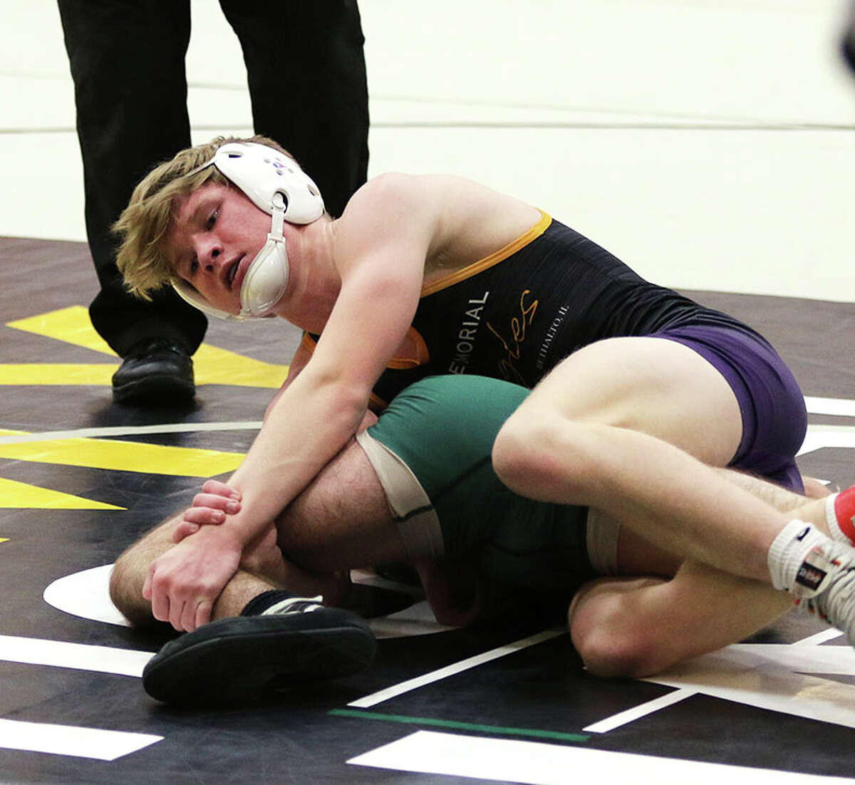 CM's Caleb Scott (top) advanced to this weekend's Highland Class 2A Sectional and will face Lane Griffin of Centralia in the opening round. Scott is shown in action earlier this season.
