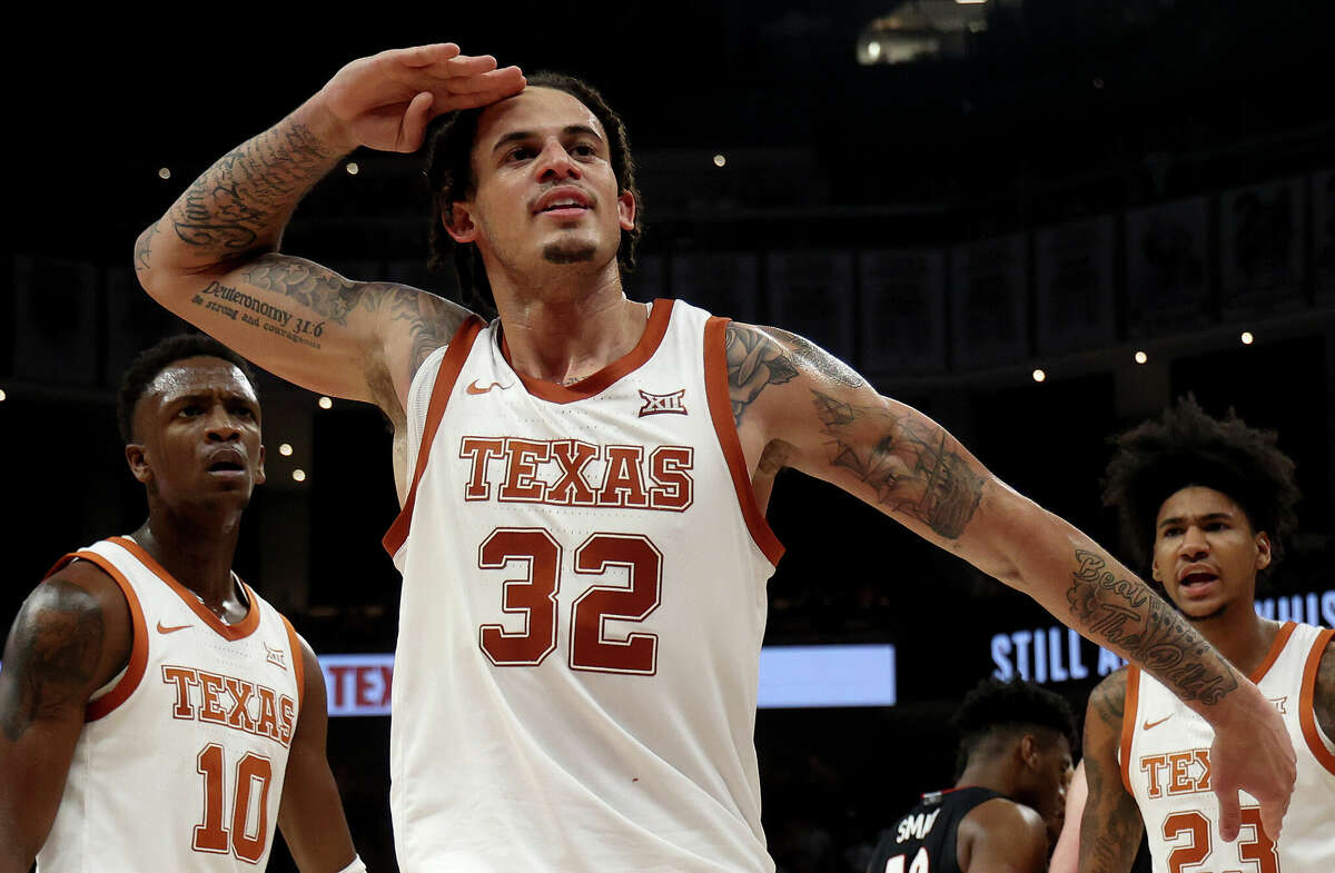 Christian Bishop #32 of the Texas Longhorns salutes the crowd after scoring a slam dunk in the second half of the game between the Gonzaga Bulldogs and the Texas Longhorns at the Moody Center on November 16, 2022 in Austin, Texas.
