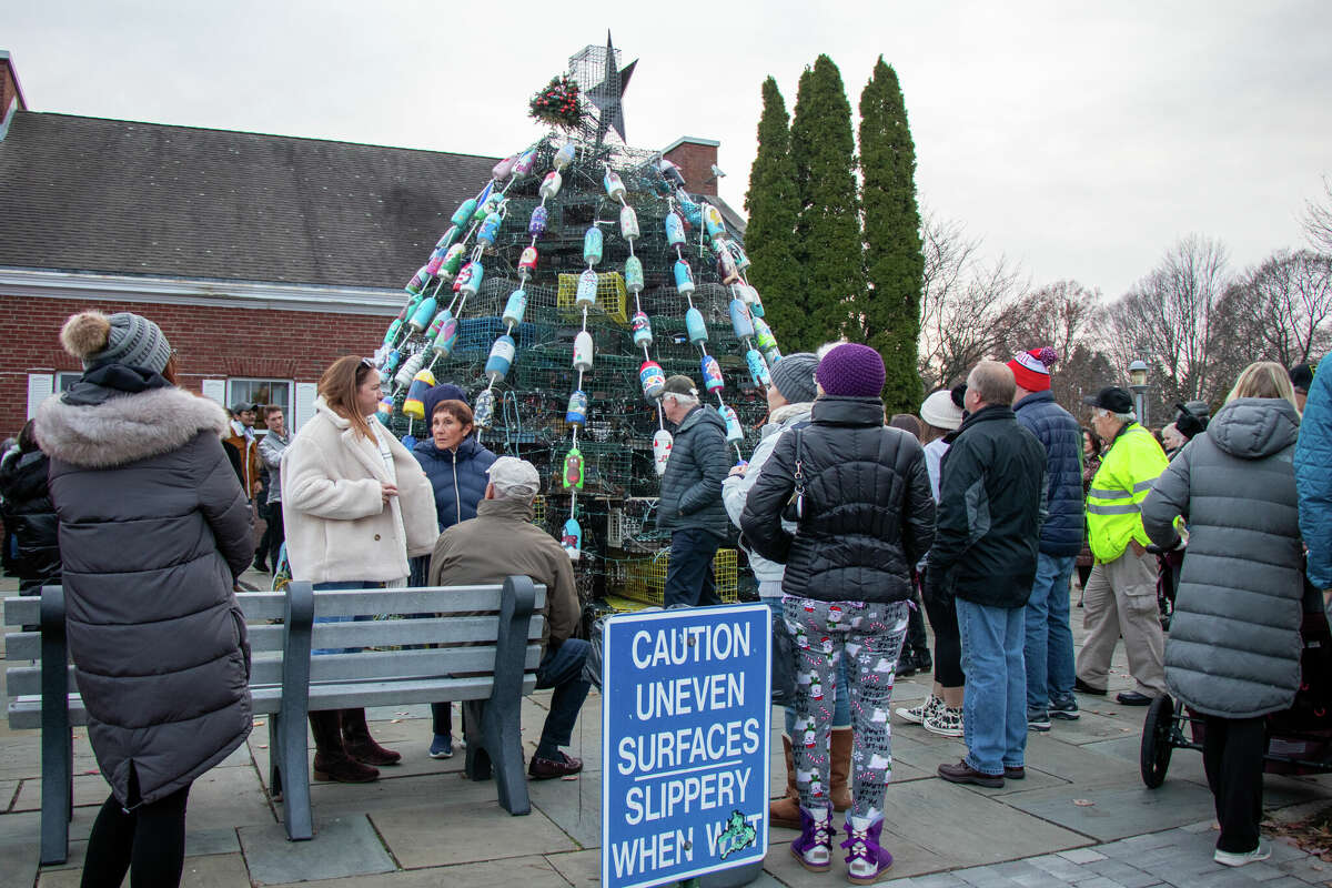 The Milford community arrive at the lighting of the Lobster Trap Christmas Tree on Sunday.