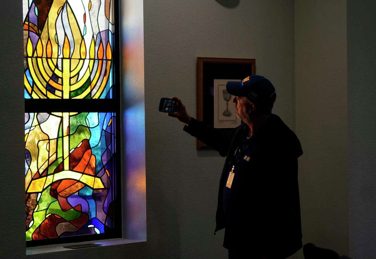 A stained glass window that once had bullet holes is now repaired at Congregation Beth Israel in Colleyville, Texas, Thursday, April 7, 2022. In January, four were taken hostage by a pistol-wielding man during a Shabbat service.