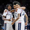 Connecticut's Tristen Newton (2), Andre Jackson Jr. (44) and Jordan Hawkins (24) huddle together in the second half of an NCAA college basketball game, Friday, Nov. 18, 2022, in Storrs, Conn. (AP Photo/Jessica Hill)