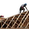 Men work on framing of homes in a subdivision near Texas 242 and F.M. 1314, Wednesday, Aug. 24, 2022, in Conroe.