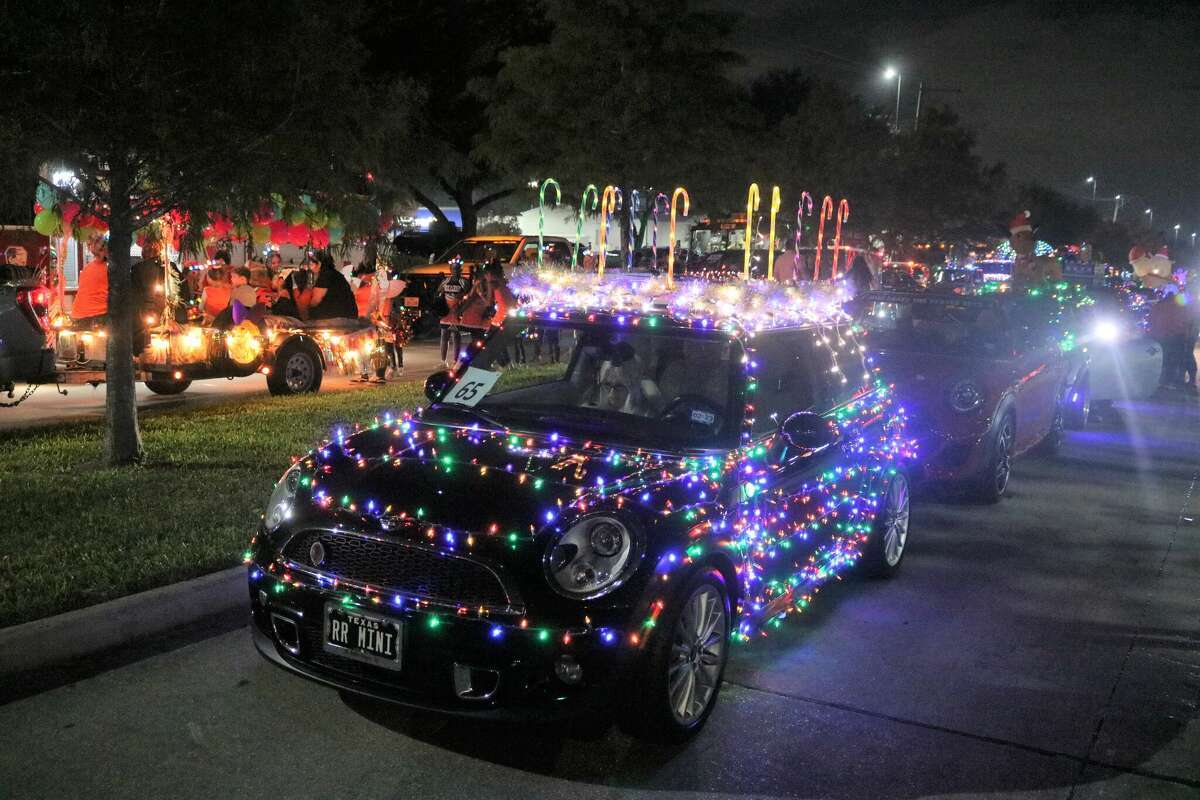 With candy canes on its roof and lights all over, a vehicle prepares to turn on Fairmont Parkway in the Pasadena parade.