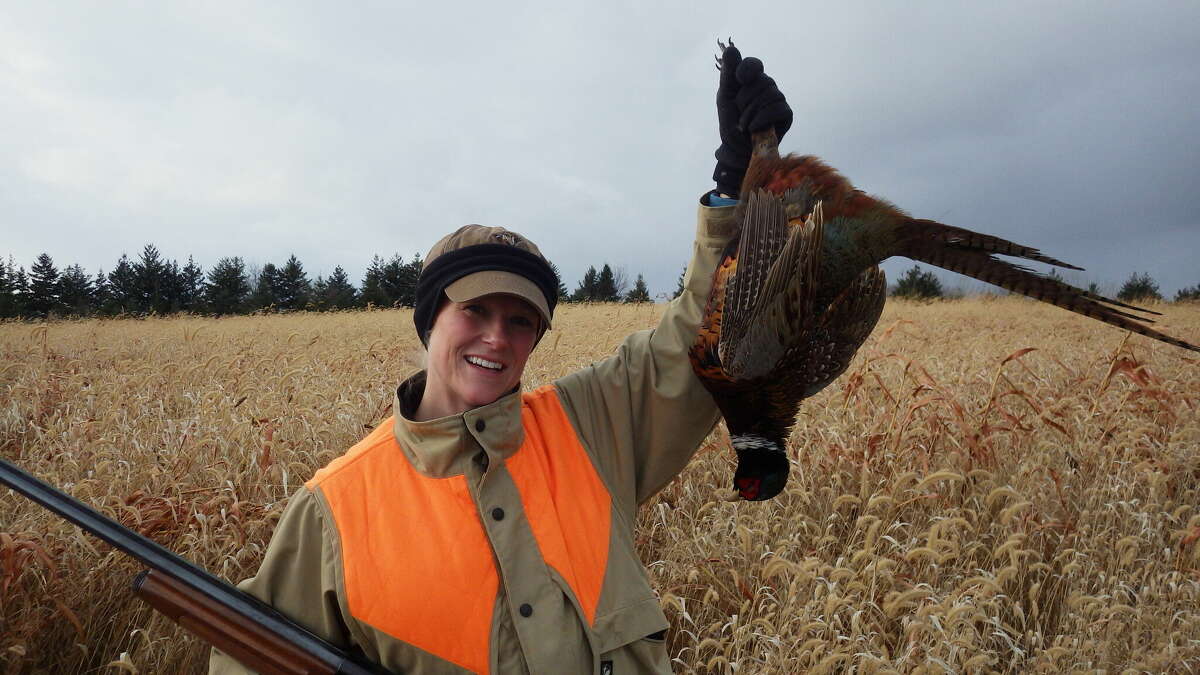 Kelly Straka of Lansing enjoys December pheasant hunting.