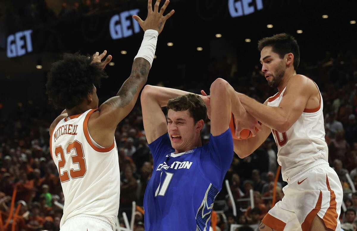 Brock Cunningham and Dillon Mitchell kept Creighton star Ryan Kalkbrenner in check during Texas’ win Dec. 1 at the Moody Center in Austin.