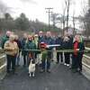 Residents, town officials and town staff gathered Dec. 4 to celebrate the official opening and ribbon cutting for the Sue Grossman Greenway extension, recently completed in Winsted. 