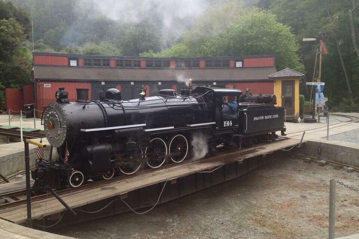 The historic 1914 locomotive in front of the 2020 CZU wildfire. 