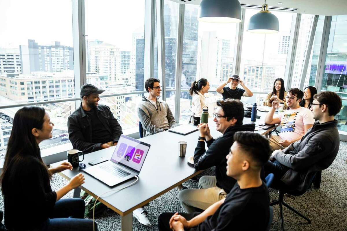 Employees at fintech startup Bolt gather for an icebreaker at a WeWork shared work space in San Francisco. Bolt offers its employees a four-day workweek.