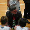 Meridian coach Mitch Bohn addresses his team during a timeout in Monday's game against Ogemaw Heights, Dec. 5, 2022.