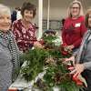Olde Ripton Garden Club members, left to right, Pat Robik, Lisa DiNardo, Joan Mauri and Debby Garrow prepare holiday wreaths Monday, Dec. 5, 2022, at the Shelton Community Center.
