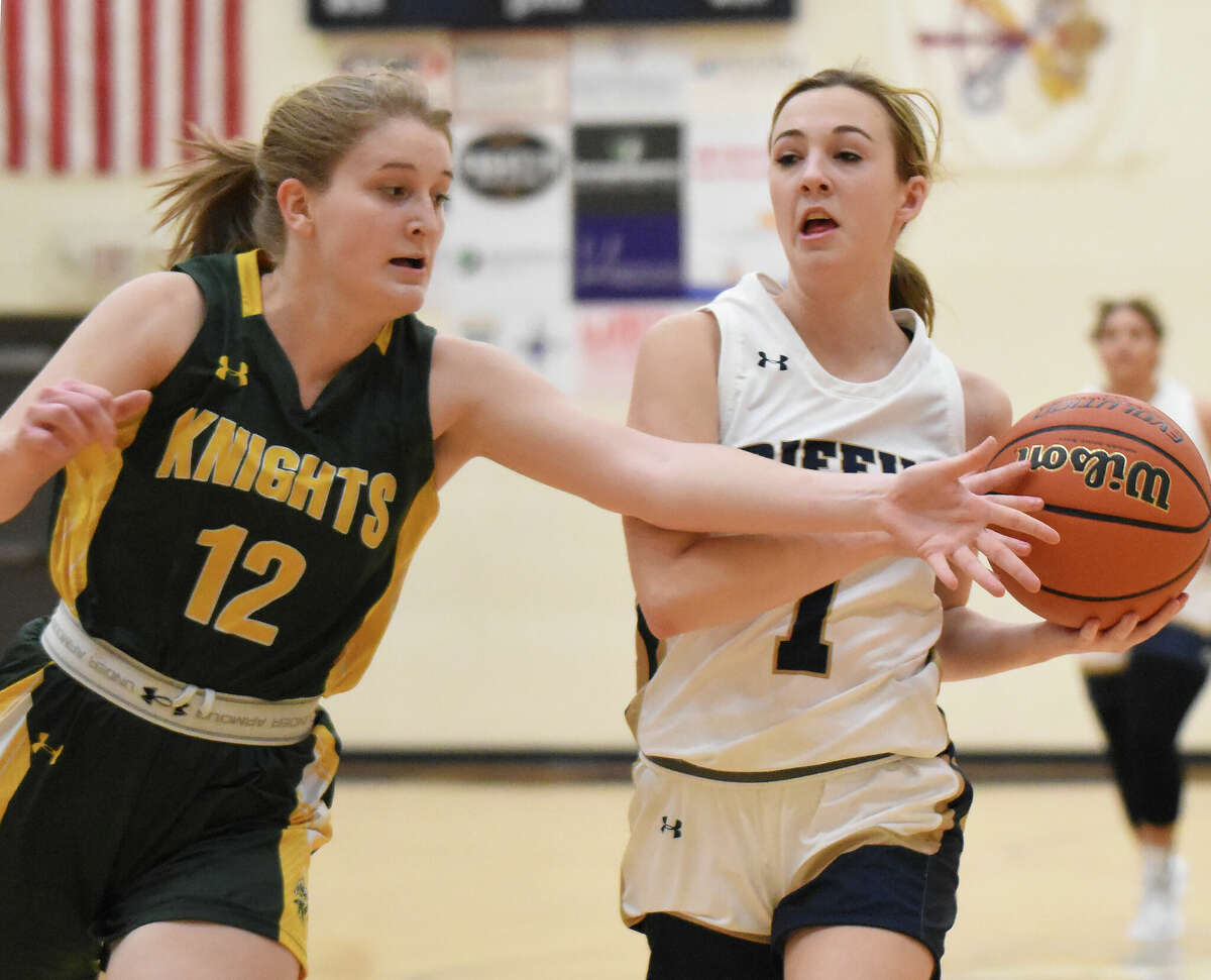 Father McGivney's Mary Harkins drives against Metro-East Lutheran's Claire Sherfy in Gateway Metro Conference action in Glen Carbon.