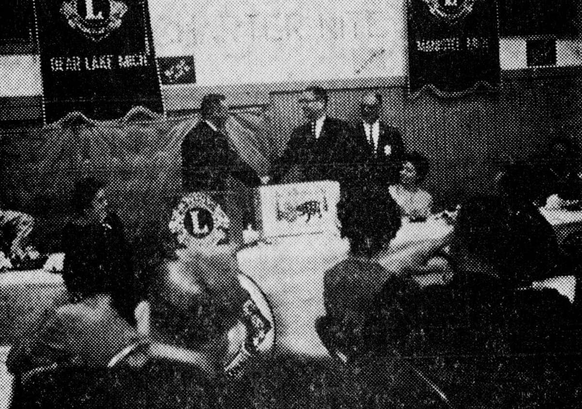 Westley Rowland, of Michigan State University, who was the guest speaker at this weekend's event where the Kaleva Lions Club received its charter — congratulates club president, Dick Helfrich. The photo was published in the News Advocate on Dec. 12, 1962.