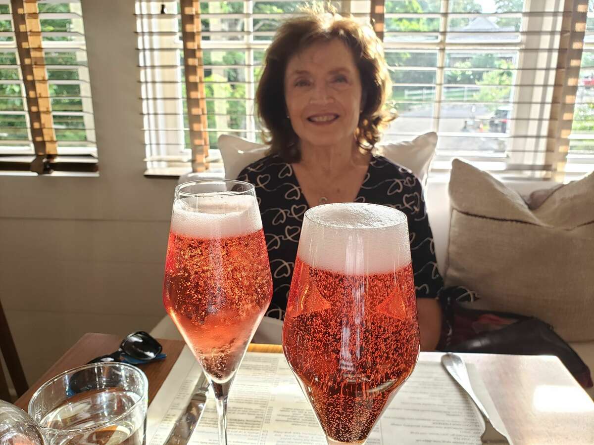 Marsha Whitman enjoys the pretty color of pink sparkling wine.