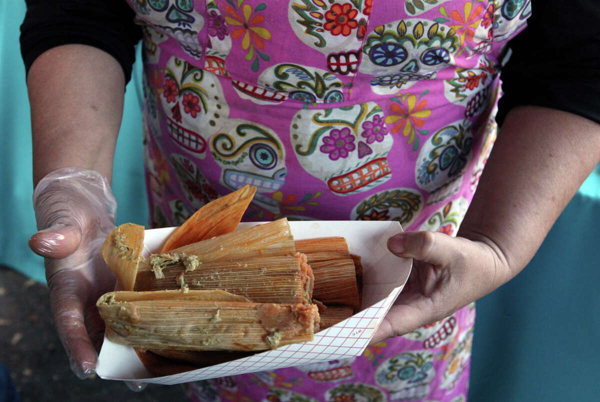 Shirley Keresztury-Diaz of Mi Casa Tamales serves tamales to customers at the Pearl in 2010.