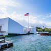 The USS Arizona Memorial in Pearl Harbor, Oahu, Hawaii view from a shuttle boat arriving at the pier at Honolulu, Hawaii, USA.