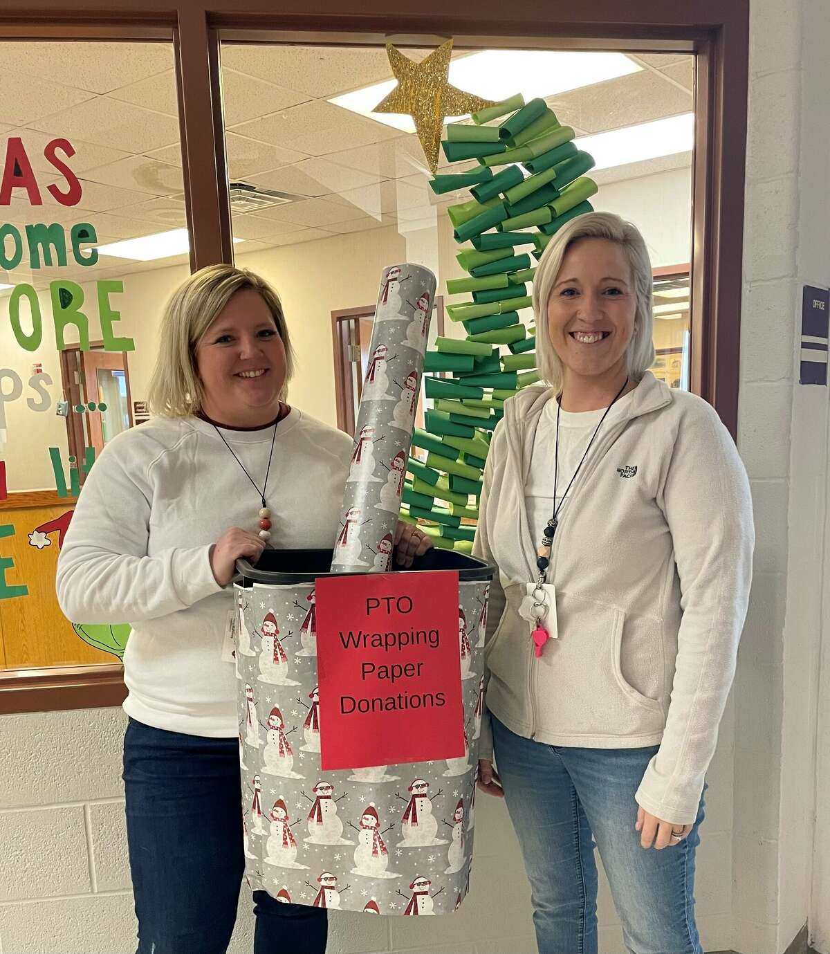 PTO President Caitlyn Middaugh and Treasurer Kristen Mahoney get ready to turn the hallways of Cass City Elementary into a Christmas wonderland. 