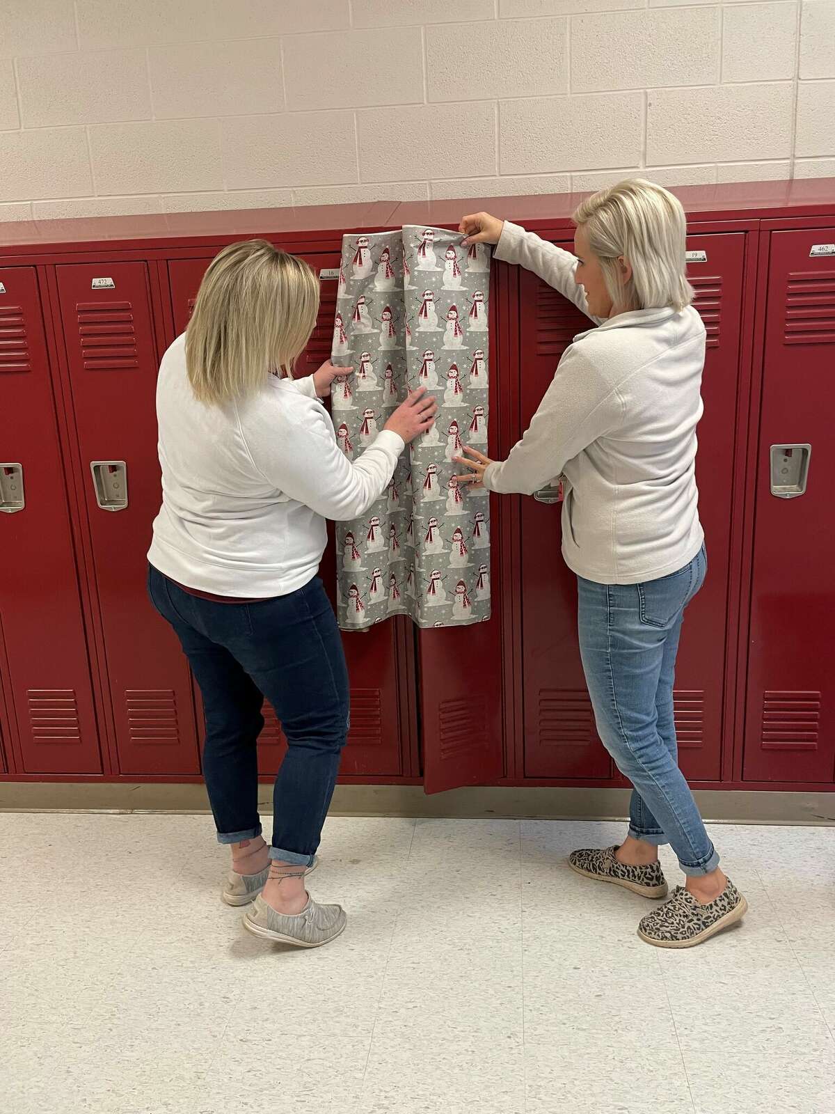 PTO president Caitlyn Middaugh and treasurer Kristen Mahoney getting ready to turn the hallways of Cass City elementary into a Christmas wonderland. 