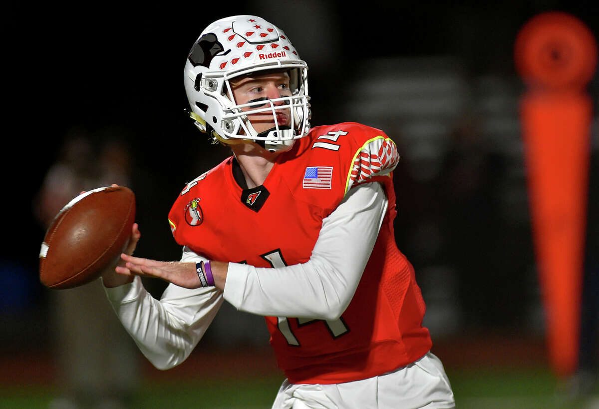 Greenwich QB Jack Wilson prepares to throw a pass during football action against St. Joseph in Greenwich, Conn., on Friday October 14, 2022.