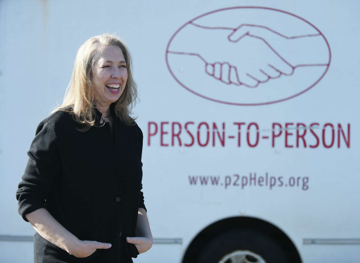 Person to Person CEO Nancy Coughlin at a food giveaway at the East Norwalk Association Library in Norwalk on Nov. 22. The Giving Fund supports clients of Darien-based Person to Person. 