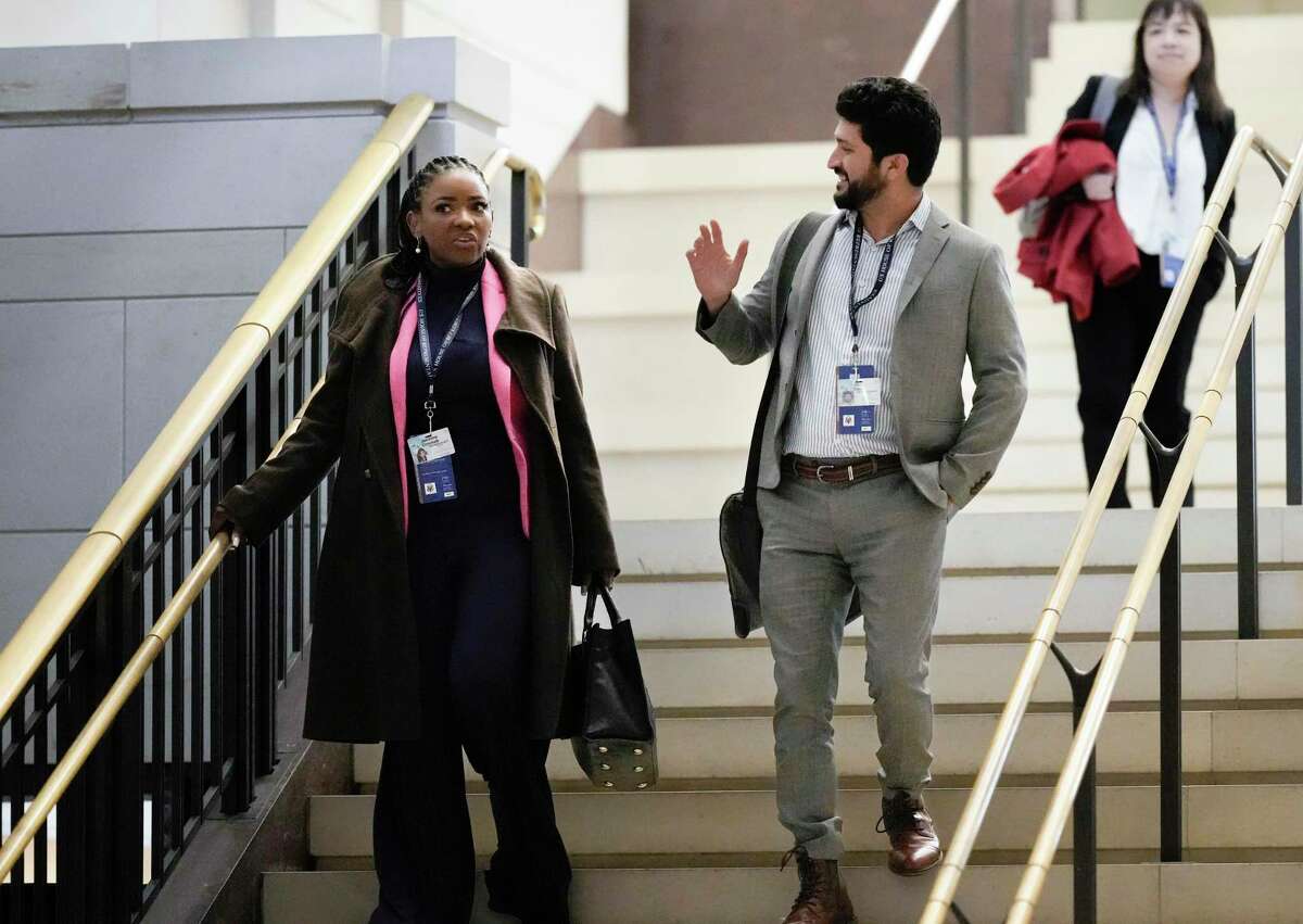 Rep.-elect Jasmine Crockett, D-Texas, left, and Rep.-elect Greg Casar, D-Texas, join newly-elected members of the House of Representatives at the Capitol for an orientation program, in Washington, Monday, Nov. 14, 2022. (AP Photo/J. Scott Applewhite)
