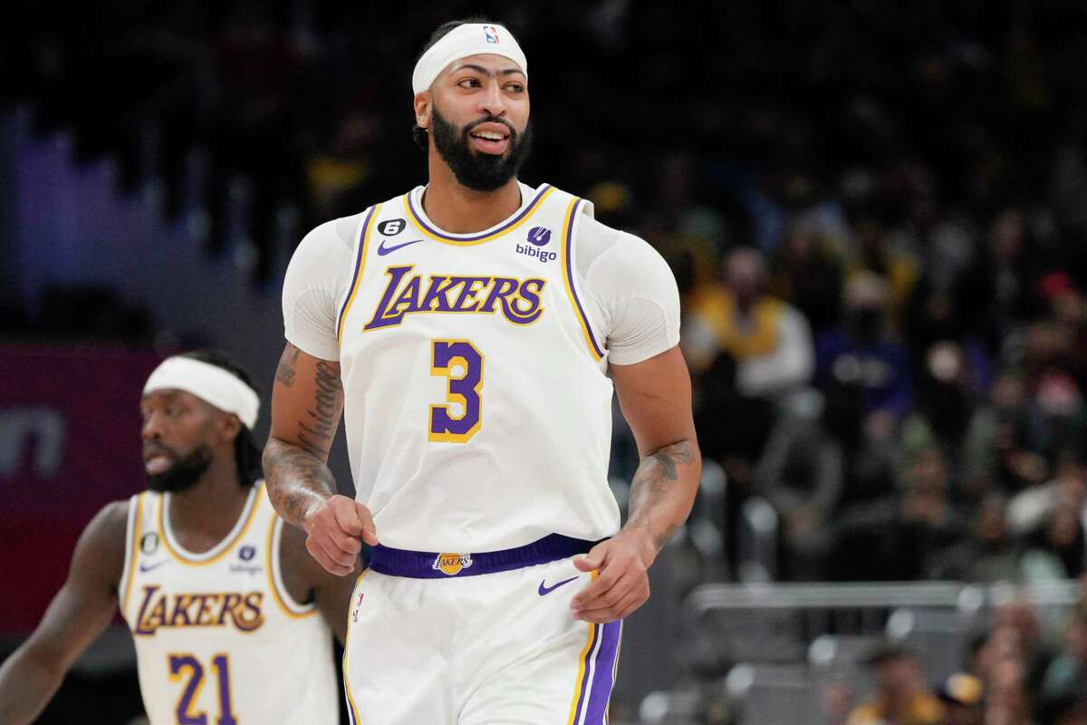 Los Angeles Lakers forward Anthony Davis (3) smiles after scoring against the Washington Wizards during the first half of an NBA basketball game, Sunday, Dec. 4, 2022, in Washington. The Lakers won 130-119. (AP Photo/Jess Rapfogel)