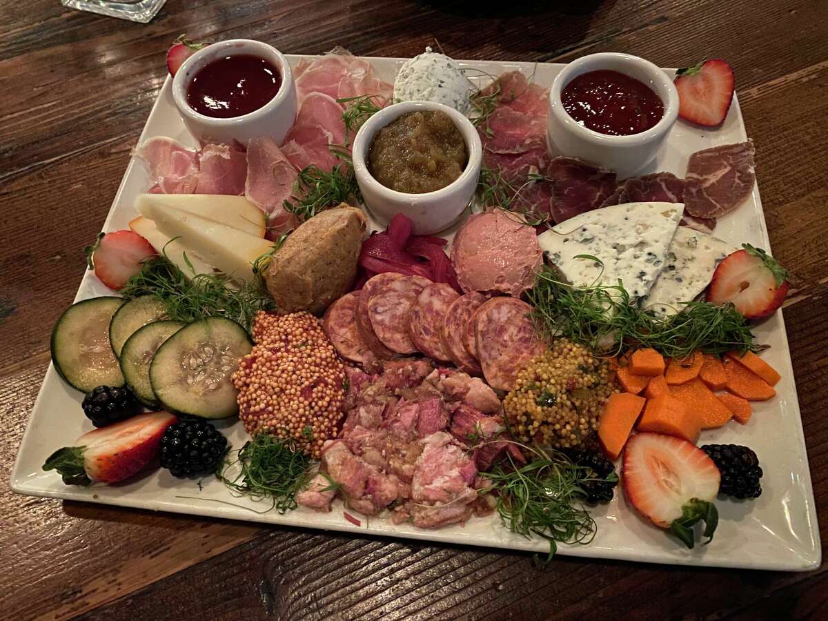 An enticing charcuterie plate waiting to be shared at Cured.