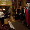 Rayanna Hoeft, Director of Educational Programming, welcomes educators as they begin their tour in the holiday decorated McFaddin-Ward House during an Educator Appreciation night at the historic home museum Tuesday. Photo made Tuesday, December 6, 2022 Kim Brent/Beaumont Enterprise