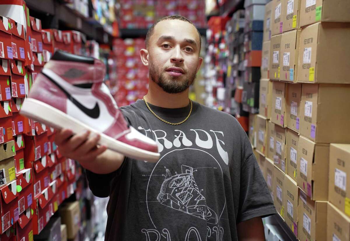 Tony Malveaux, co-founder and director of authentication at Tradeblock, an app for selling and trading high-end sneakers, in the back of Exclusive Elements, a sneaker shop in southeast Houston that the co-founders worked with before they expanded into their own warehouse space.