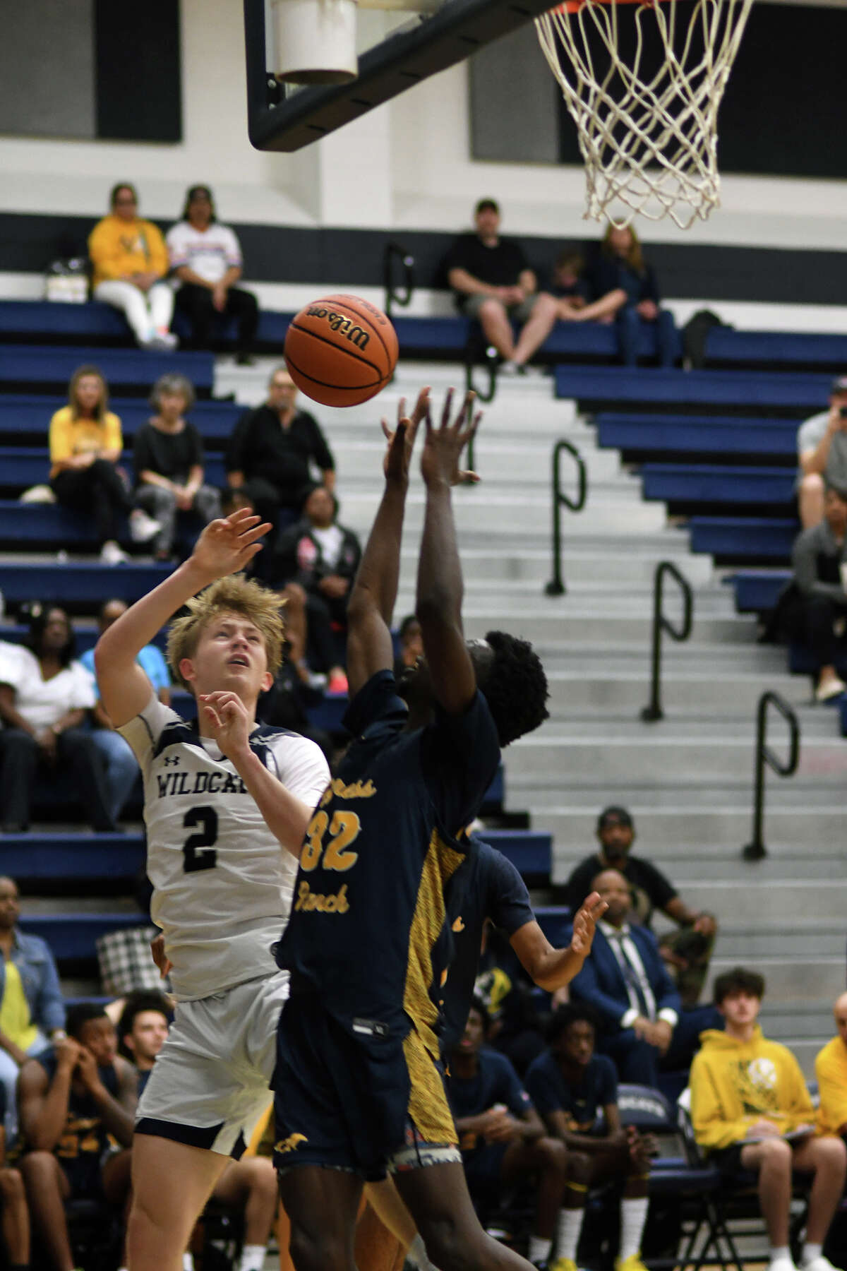 Tomball Memorial junior small forward Luke Reder (2) works for a shot against Cy Ranch senior small forward Mory Sininta (32) during the first quarter of their matchup at TMHS on Dec. 6, 2022.